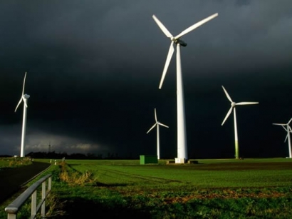 Black clouds over onshore wind turbines